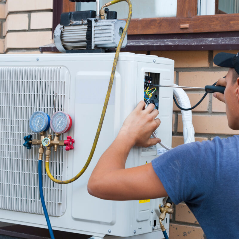 The,Worker,Installs,The,Outdoor,Unit,Of,The,Air,Conditioner