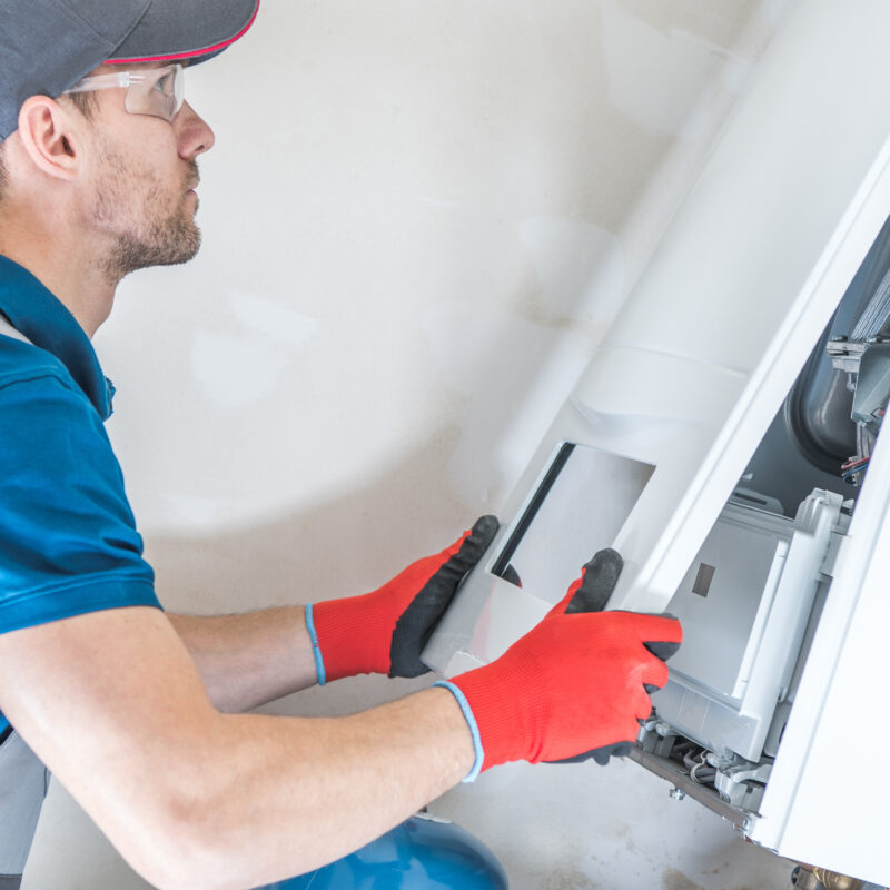 House,Heating,Unit,Repair,By,Professional,Technician.,Closeup,Photo.,Home